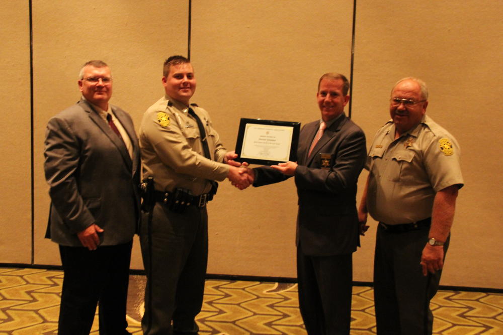 MSA Conference Awards showing Daniel Glidden accepting his award.