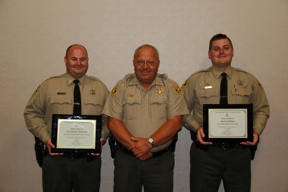 Deputies Daniel Glidden and Chris Anderson holding up their reward.